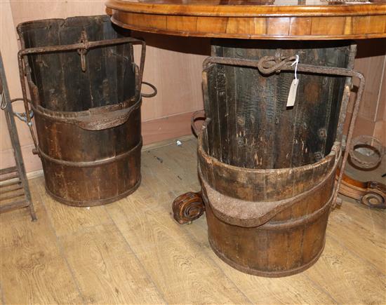 A pair of Chinese staved wood, iron bound salt buckets H.62cm